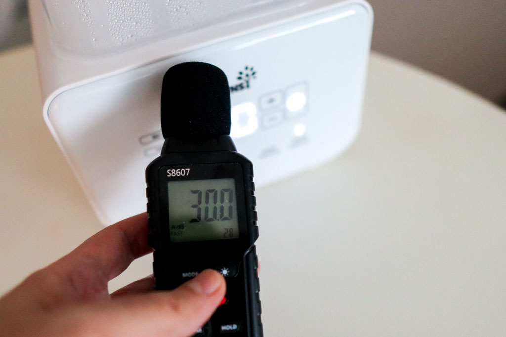 A sound meter reading 30 dB next to the Grownsy 8-in-1 Bottle Warmer during operation, showing minimal background noise.