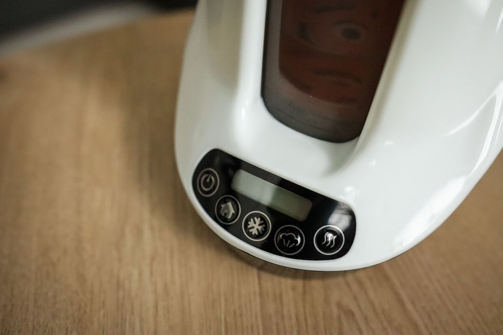 The Baby Brezza Smart Bottle Warmer's control panel with a single dial for selecting warming time.