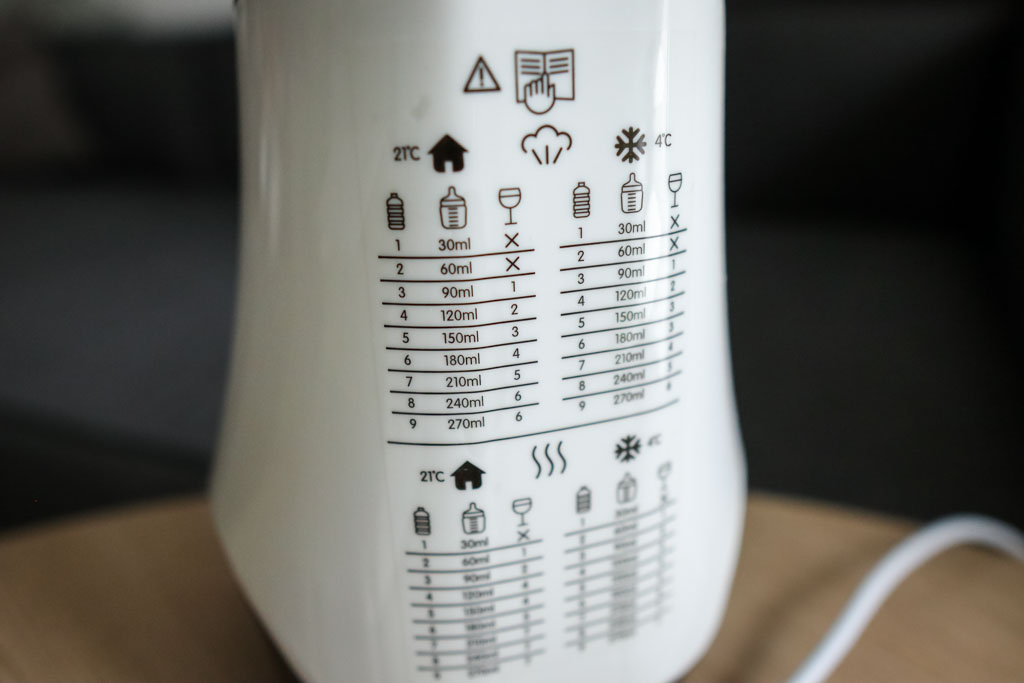 The reference chart on the Baby Brezza Smart Bottle Warmer showing recommended warming times for different bottle sizes.